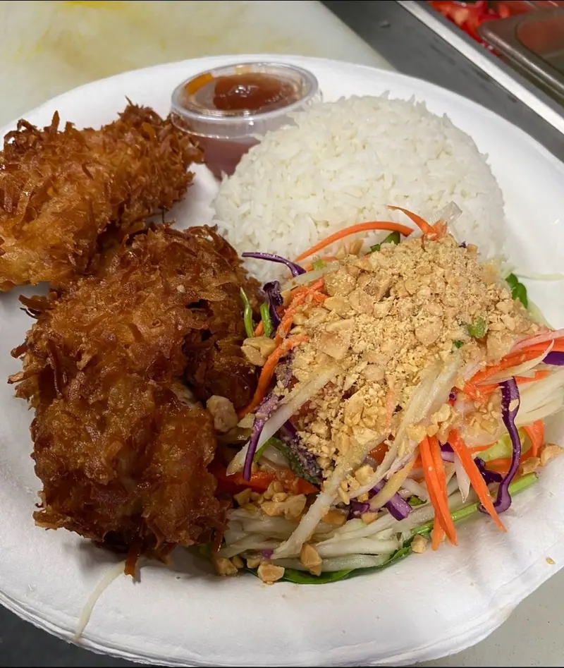 Coconut-crusted shrimp with jasmine rice, green papaya salad with crushed peanuts and sweet chili sauce